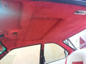 Custom red suede headliner upholstery installation by Car Stereo Tony