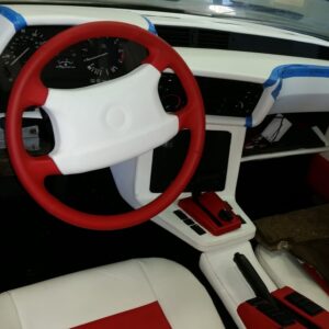 Custom red and white steering wheel and interior upholstery upgrade