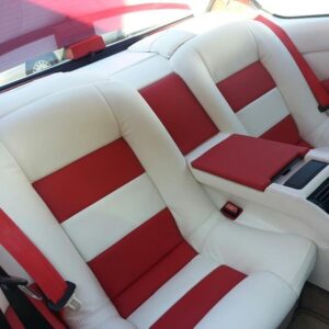 Custom red and white leather rear seat upholstery installation in Orange County