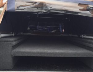 Custom trunk audio system installation with hidden amplifier rack in Orange County